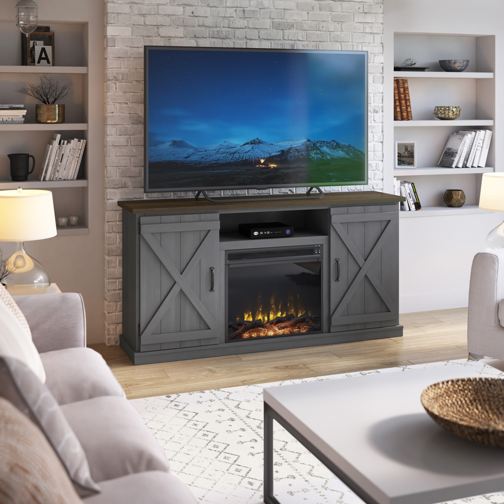 A grey modern farmhouse tv stand with an electric fireplace lights up a clean, inviting living room.