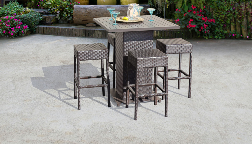 a pub style patio bar furniture set with a square high top table and four stools